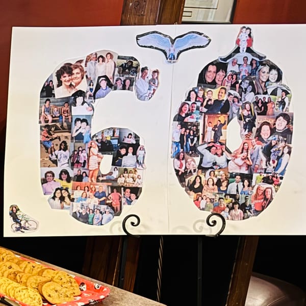 A large white board with a collage of photos forming the number "60" and a tray of cookies.